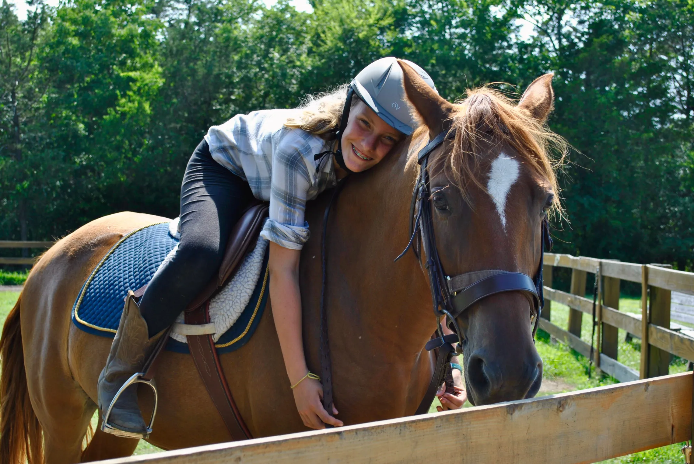 girl hugging horse
